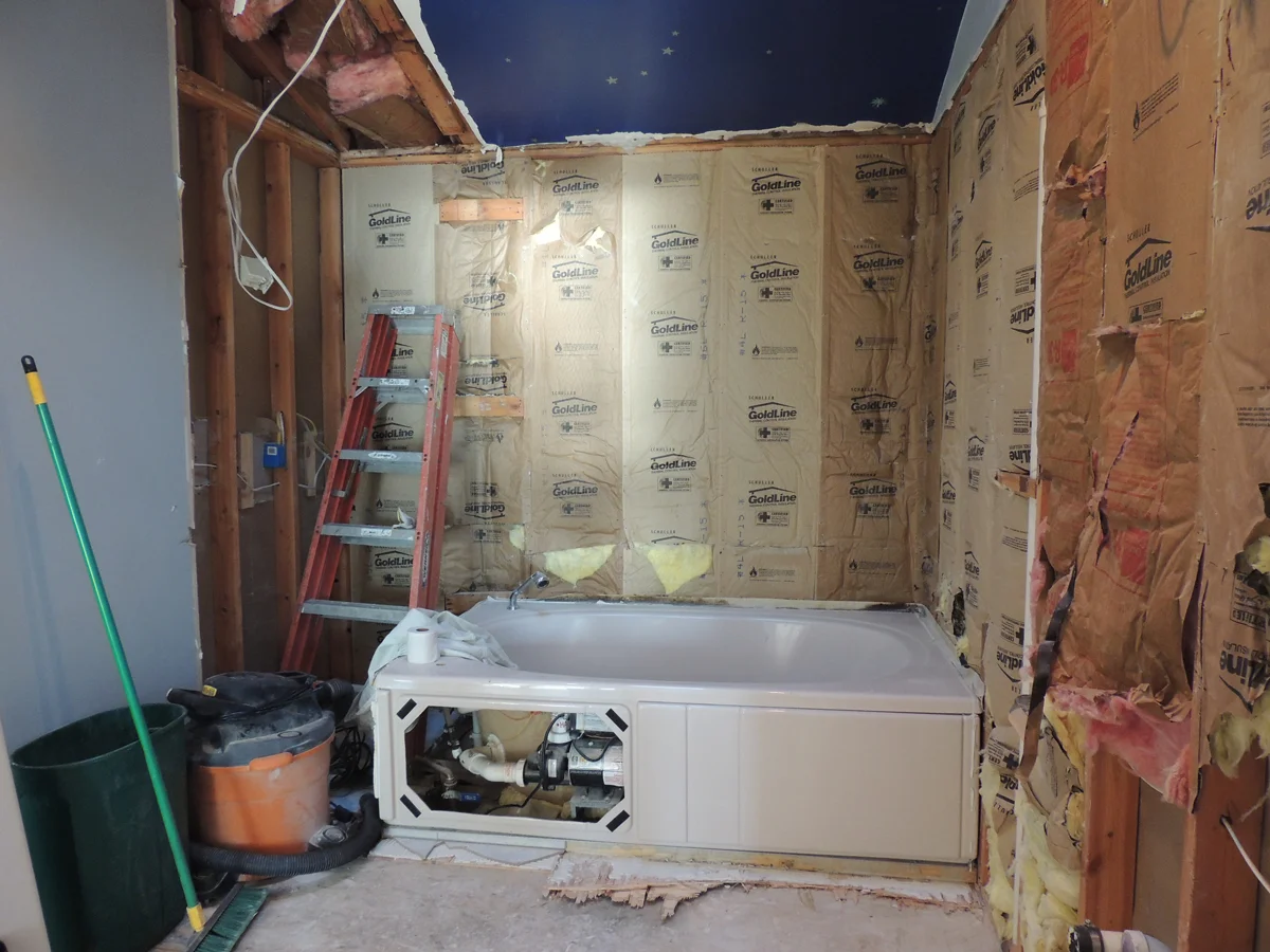 This stage of gutting the bathroom on October 5, 2014, will soon rid us of the problematic pink tub.
