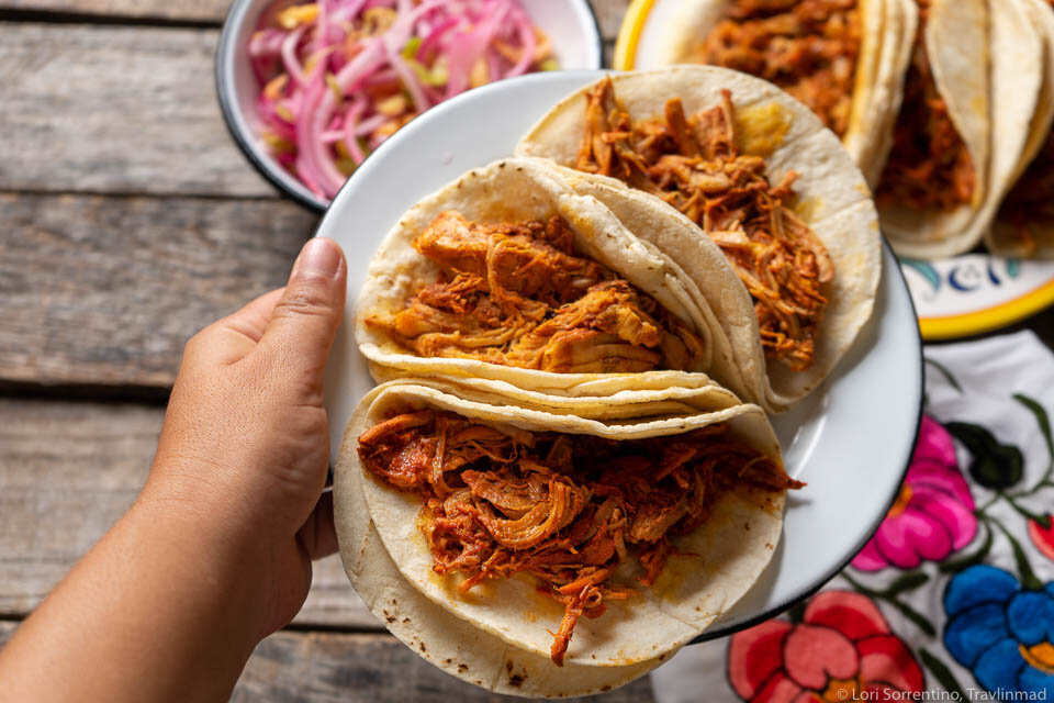 Traditional Cochinita Pibil is slow-roasted in the ground for hours