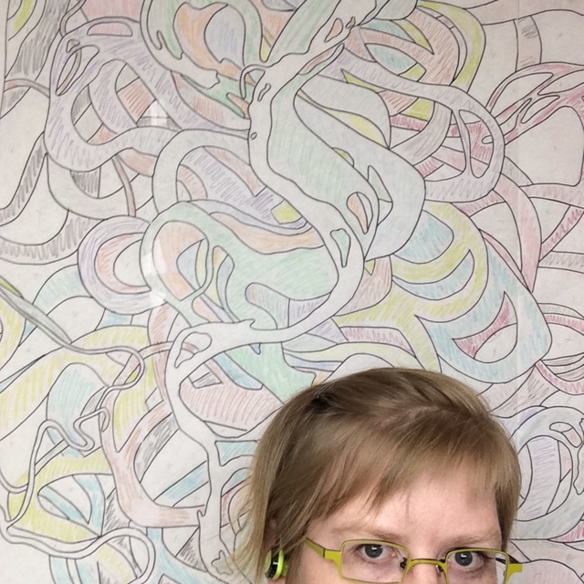 Paper pattern hanging on the design wall. My head is for scale. You know I was working hard because my hair is pinned back.