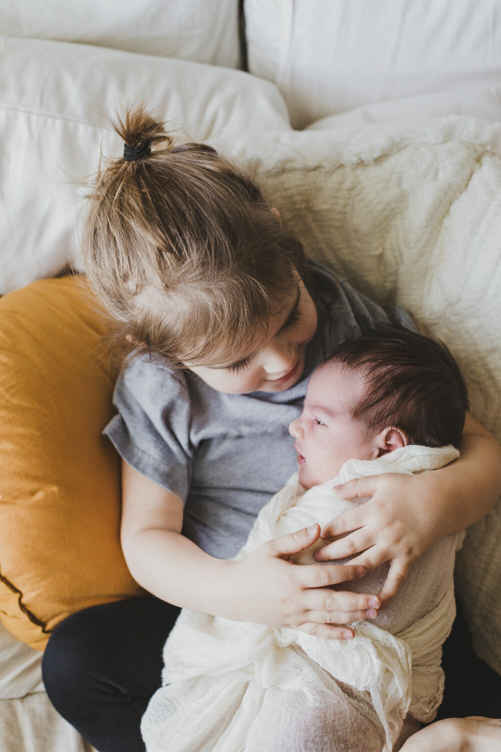 Sibling and Newborn Posing by Bend, Oregon Photographer