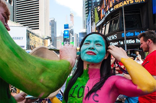 Protest Against Divisiveness - Body Painted at Times Square.  It was a call for unity and a celebration of our differences. Every day people young, old, men, women stand in public with a simple message of unity painted on their body to show their com