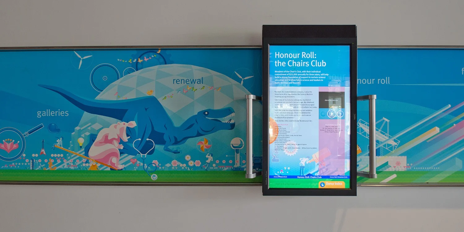 Users interact with the illustrated mural and learn more about donors with sliding touch display.