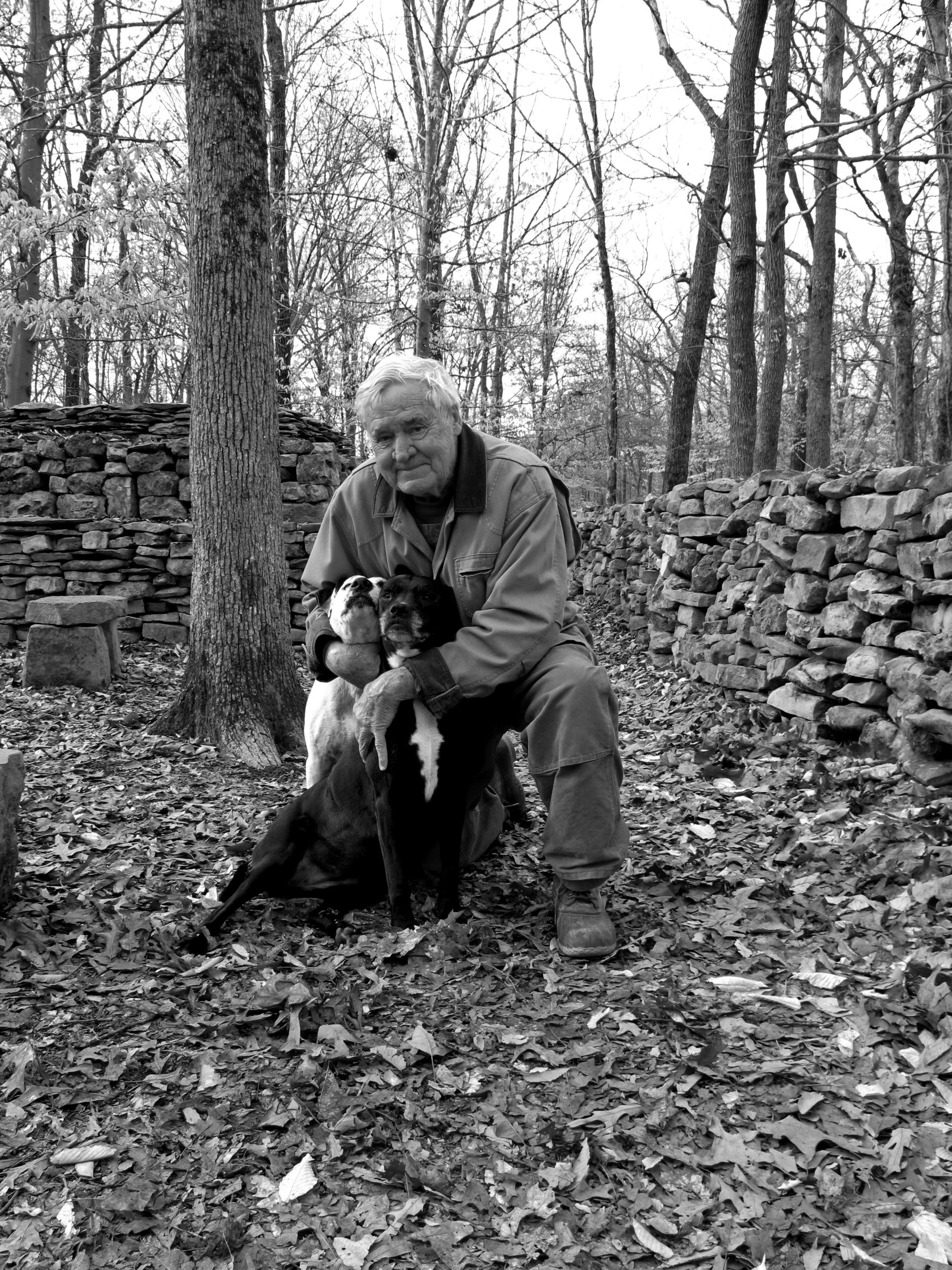 When Tom conceived of his memorial to his great-great-grandmother Te-lah-nay 25 years ago, he did not start with sketches or plans. He began by picking rocks that local farmers, clearing their land of hedgerows, had dumped by the side of the road. For 28 years has kept careful track of the truckloads, and estimates that the wall consists of 9 million pounds of stone. Each stone has been touched three times: once when he selects them and places them in his pick up truck, once at home when he unloads them into his wheelbarrow, and once when he positions each rock in The Wall. By his count, he has lifted 27 million pounds of stones, gone through three pick-up trucks, 22 wheelbarrows, and 3,900 pairs of gloves. He believes he must hold the world record for mashed fingers.