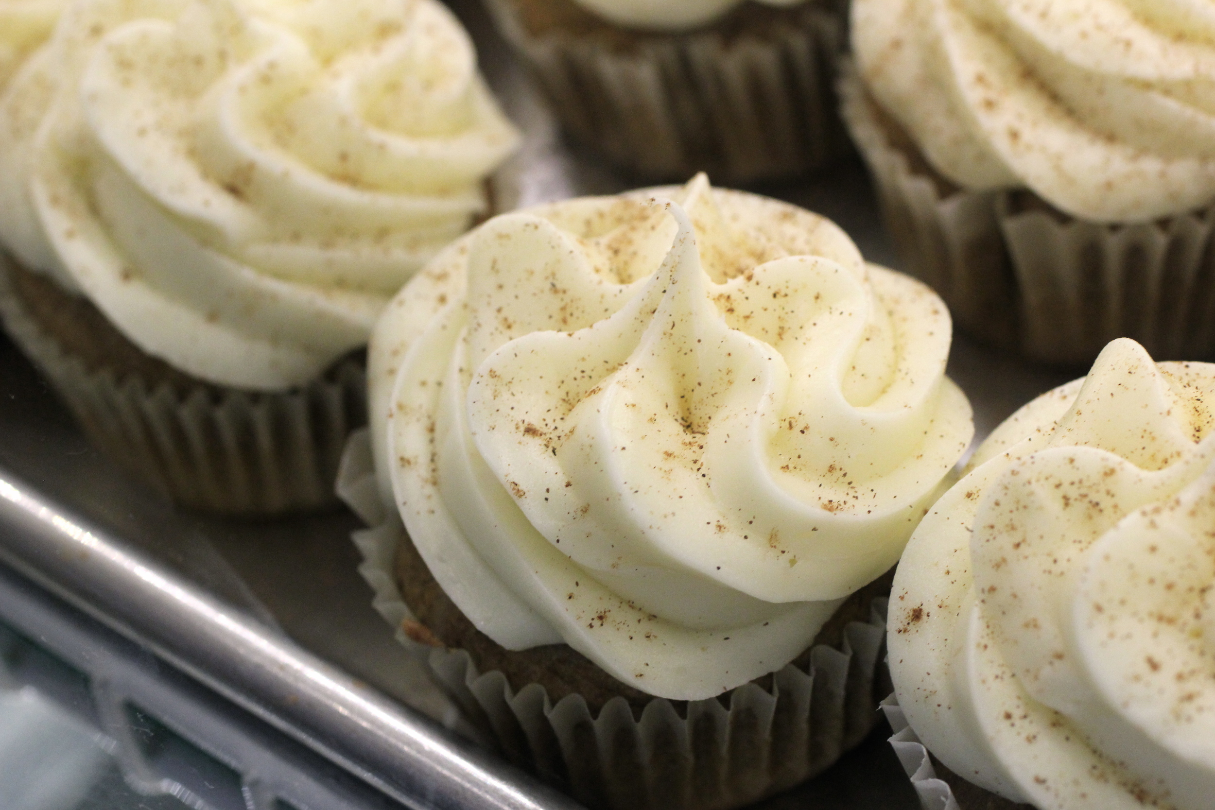 "Sweet Potato" - a sweet potato pie in a cake! Topped with buttercream icing and a dash of cinnamon. 