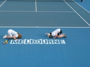 MOPT kissing Melbourne logo on court.jpg