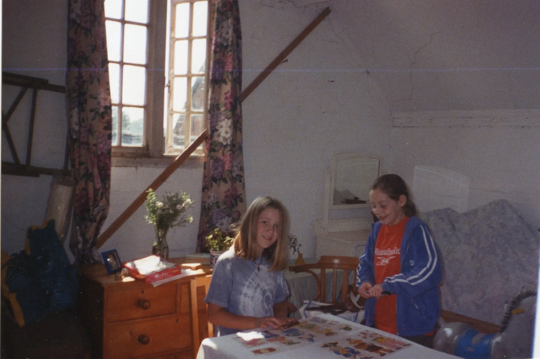 My sister in the apple room, when we briefly turned it into a den (until we cleared it out you could barely open the door, it was so full of old furniture and junk).