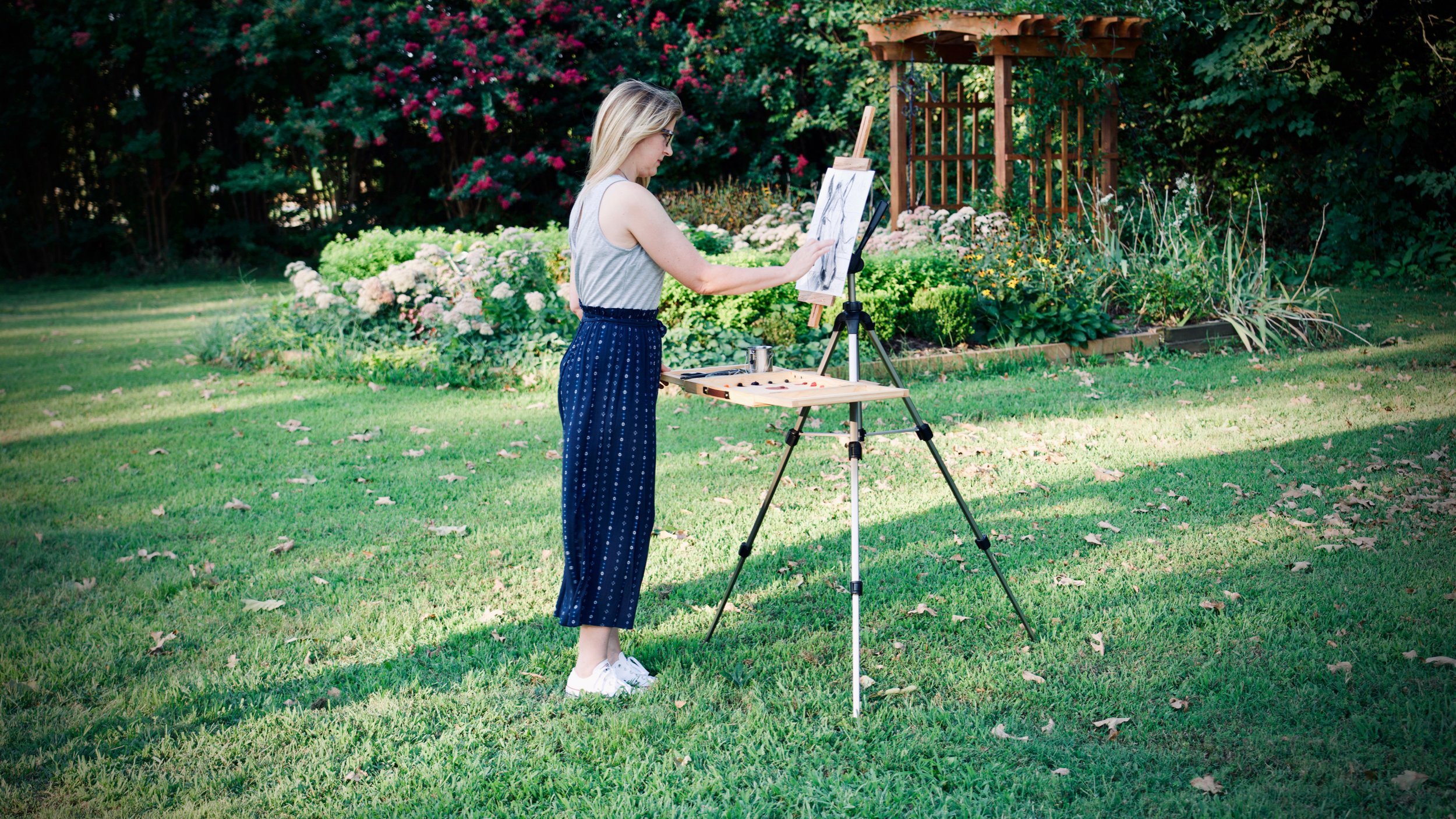 Beth painting with garden background.jpg