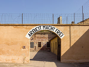 Entrance at the inner camp of Terezin.&nbsp; "Arbeit macht frei" means "Works frees."