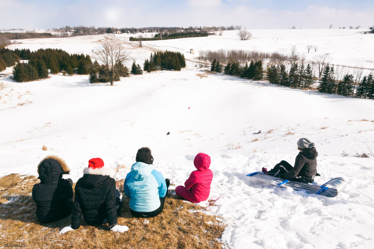 group-hill-sledding-winter-snow.jpg