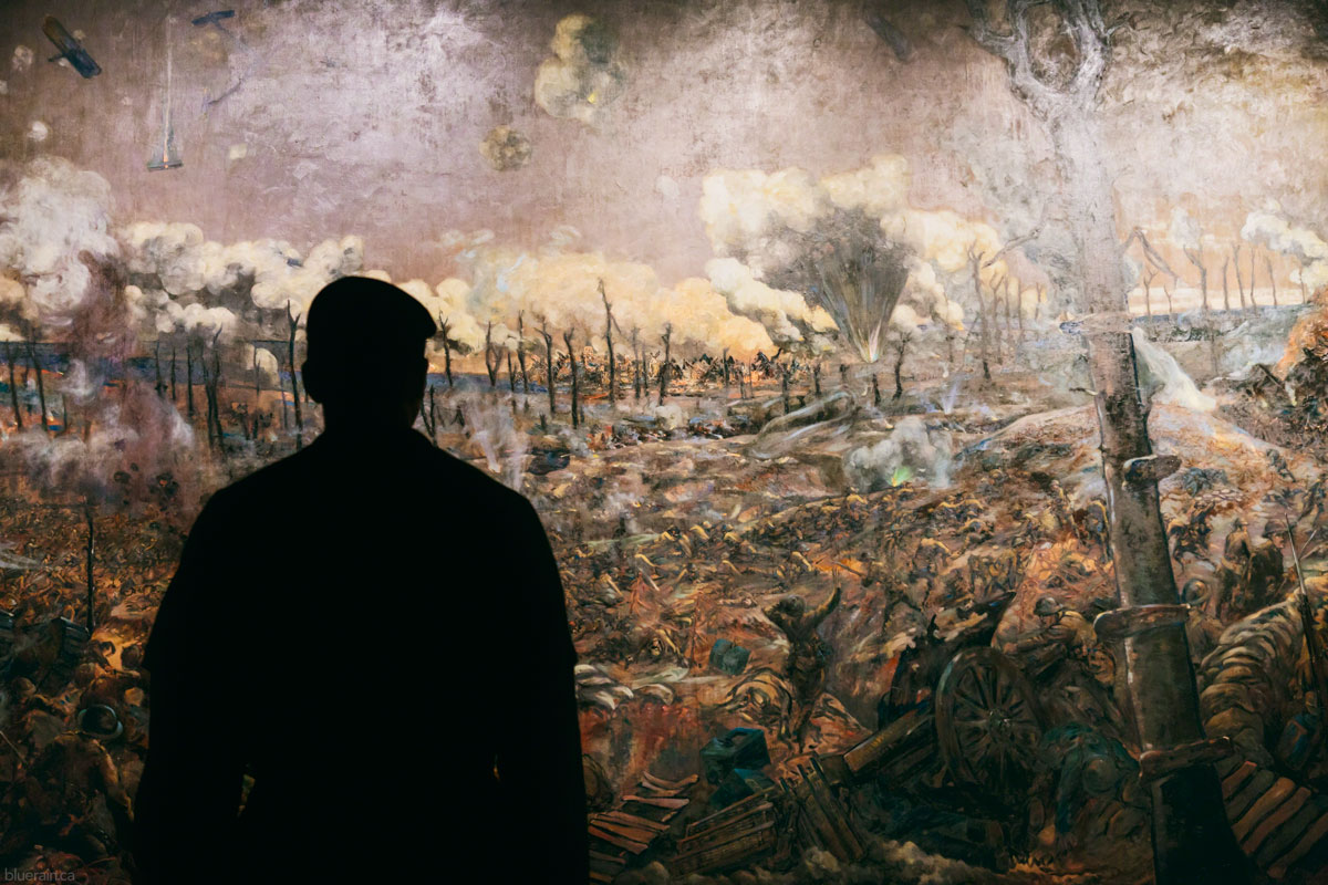 A Canadian cadet views The Battle of Courcelette painted by Louis Alexander Weirter, which depicts the ruined French town of Courcelette during the Battle of the Somme