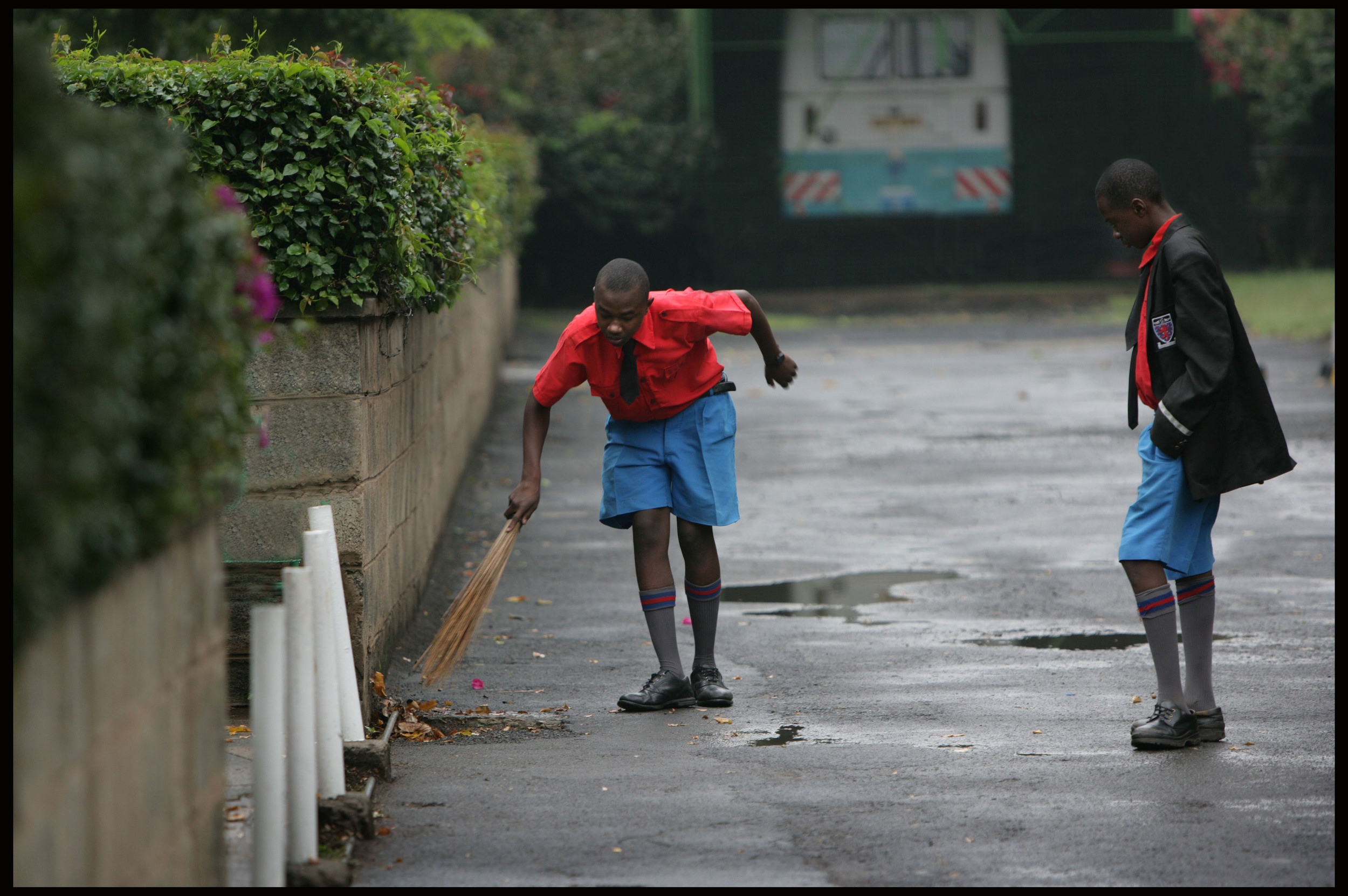 A prefect checks a boy's work, Starehe Boys Centre, Nairobi