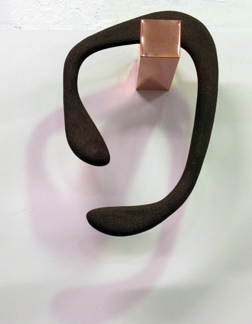 VIcissitude, frontal view showing 3 ft tall ceramic loop hanging over 2 ft long copper bar