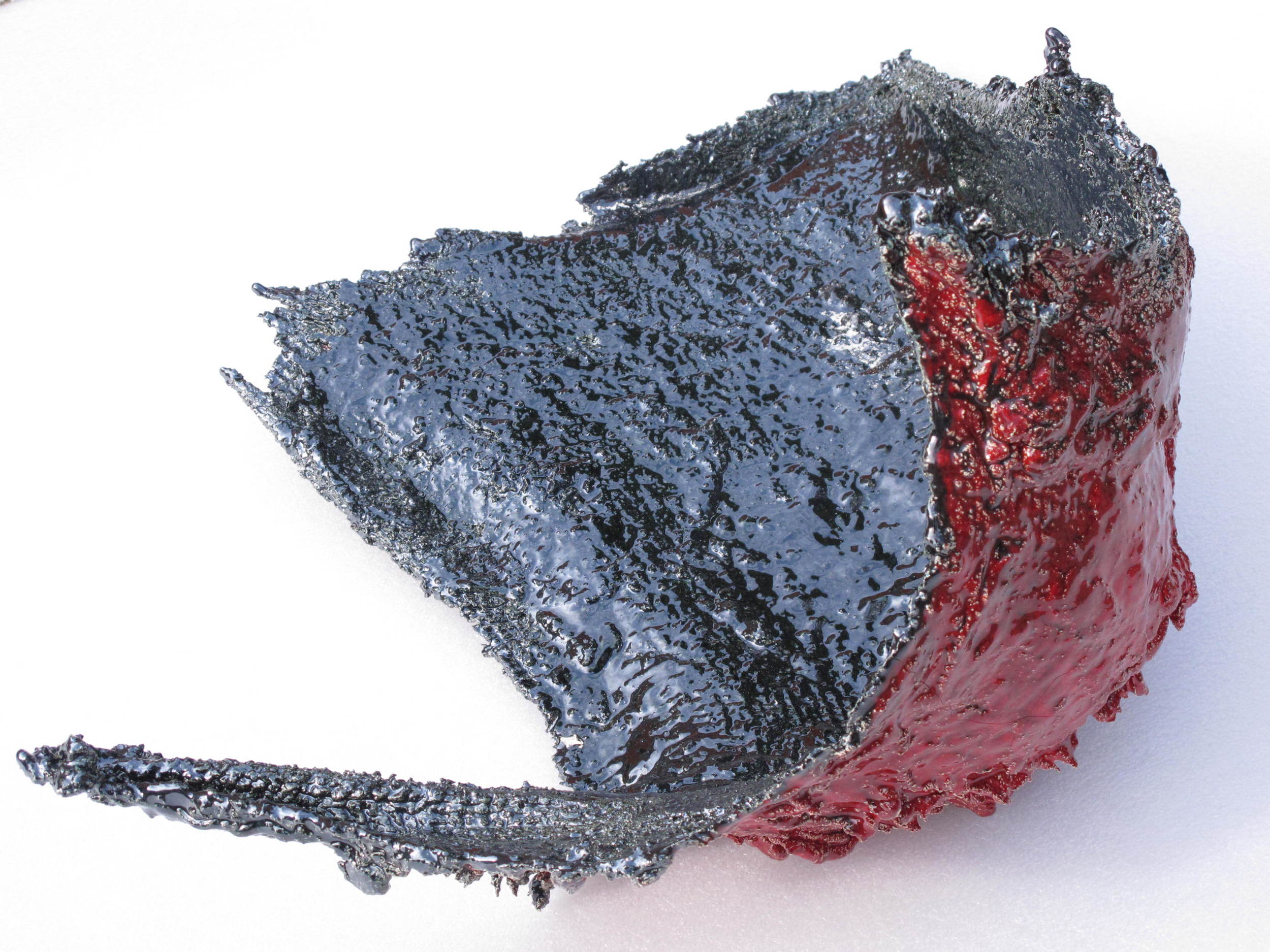 Flying Clay: Red/Black, 2013. concave surface with copper saturation glaze  