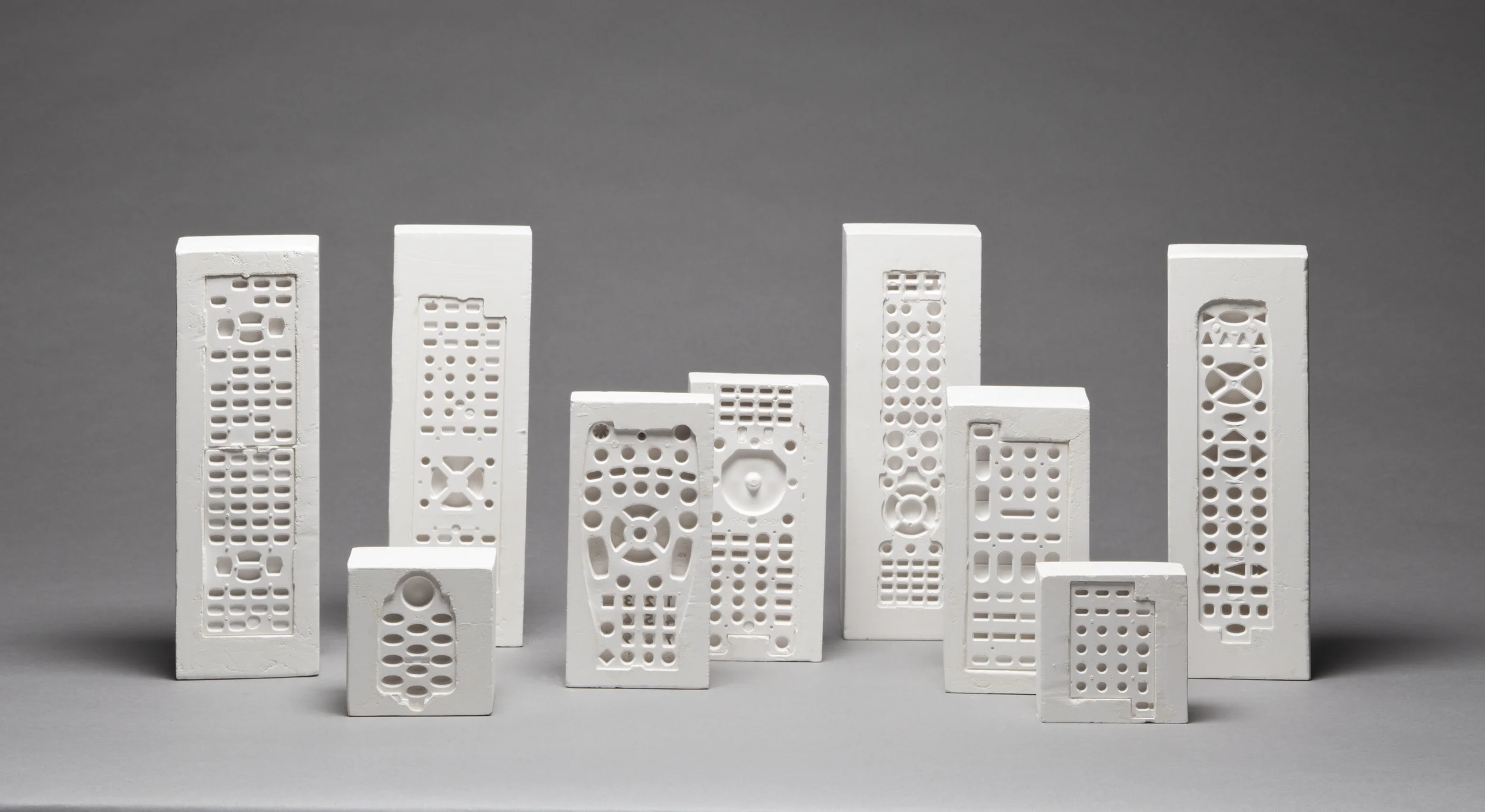 Fossils of Our Time, 2009, plaster casts. Photo: Tim Thayer. 3 1/8" W x 3 1/8", 6 1/4", or 9 1/2" H. 