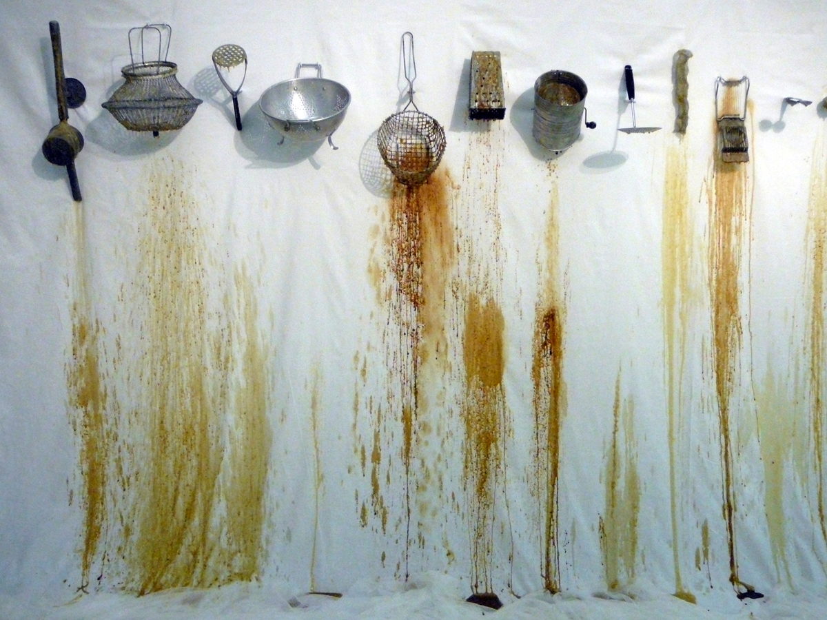 False Promises, 2009. Used metal kitchen utensils, honey, beeswax, polycotton, metal brackets. 6' H x 9' W x 3' D