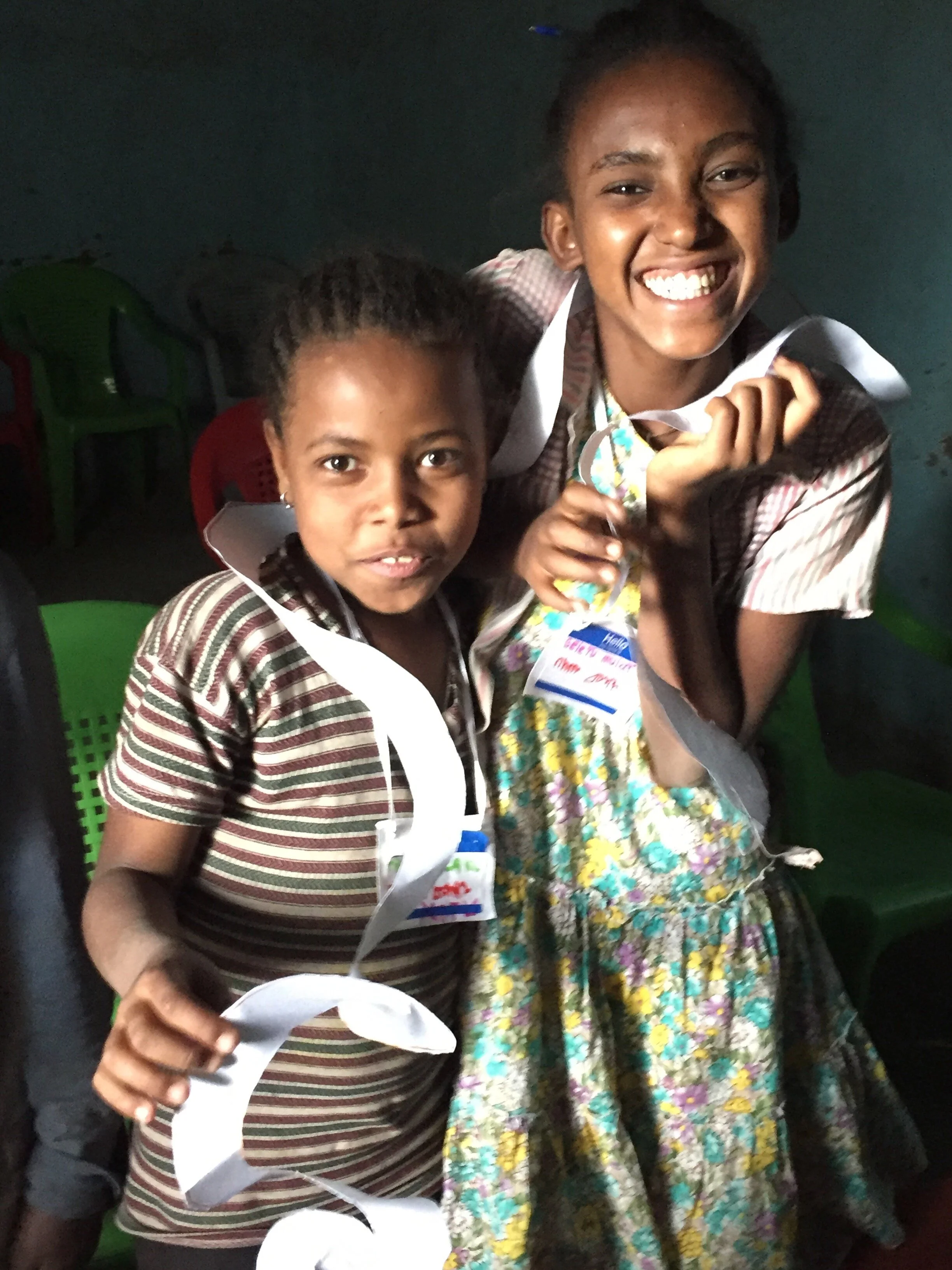young ladies proud of their creations