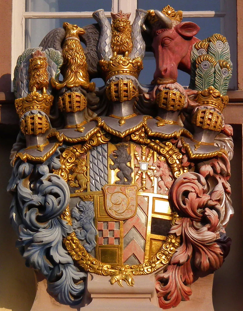 Heidelberg detail (Coat of Arms) Present coat of arms is a copy of the original by Heinrich Charrasky For a reading of the symbolism, click here: http://www.dr-bernhard-peter.de/Heraldik/Galerien/galerie1021.htm