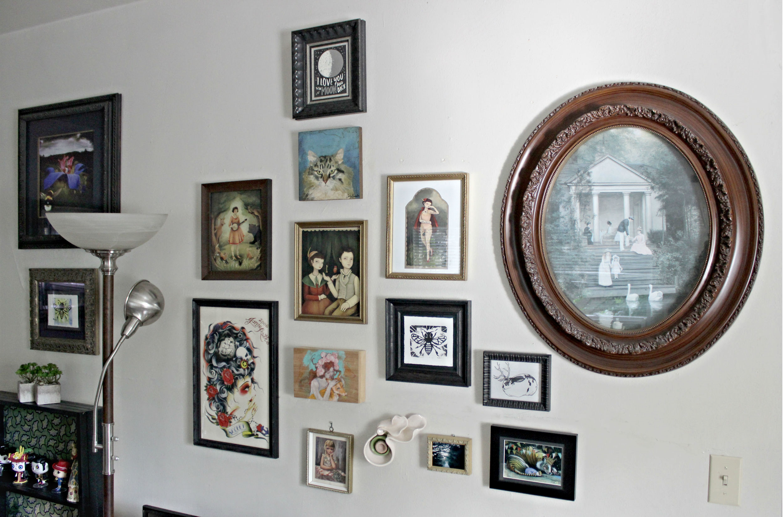 Random: A gallery wall can start with a very linear appearance and spread out to find its own shape as you collect more art. Don't be afraid to mix styles of framed works or mediums. 
