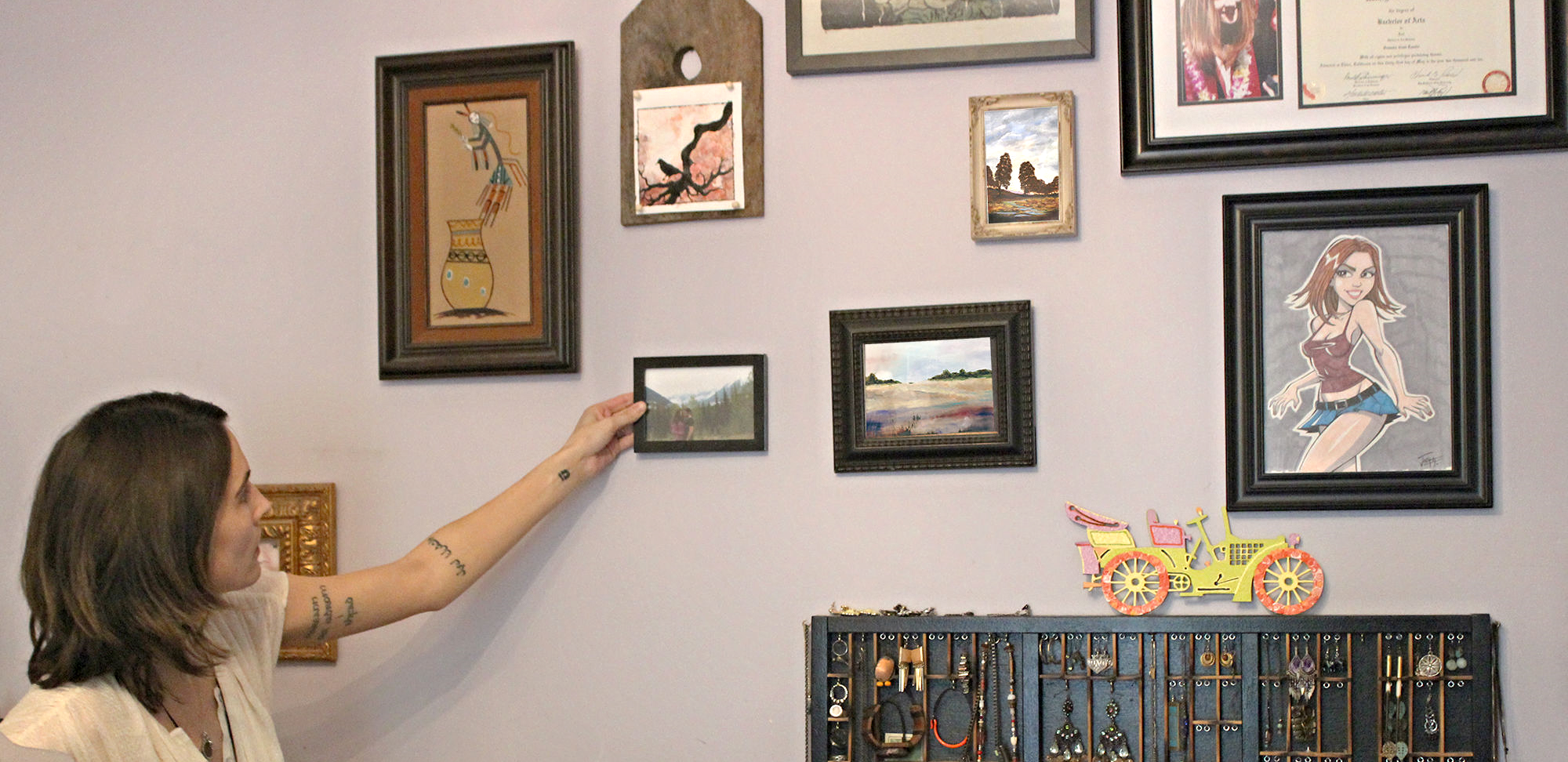 Sometimes holding up the framed artwork in its potential home gives you a better idea of how it fits in with the grouping.