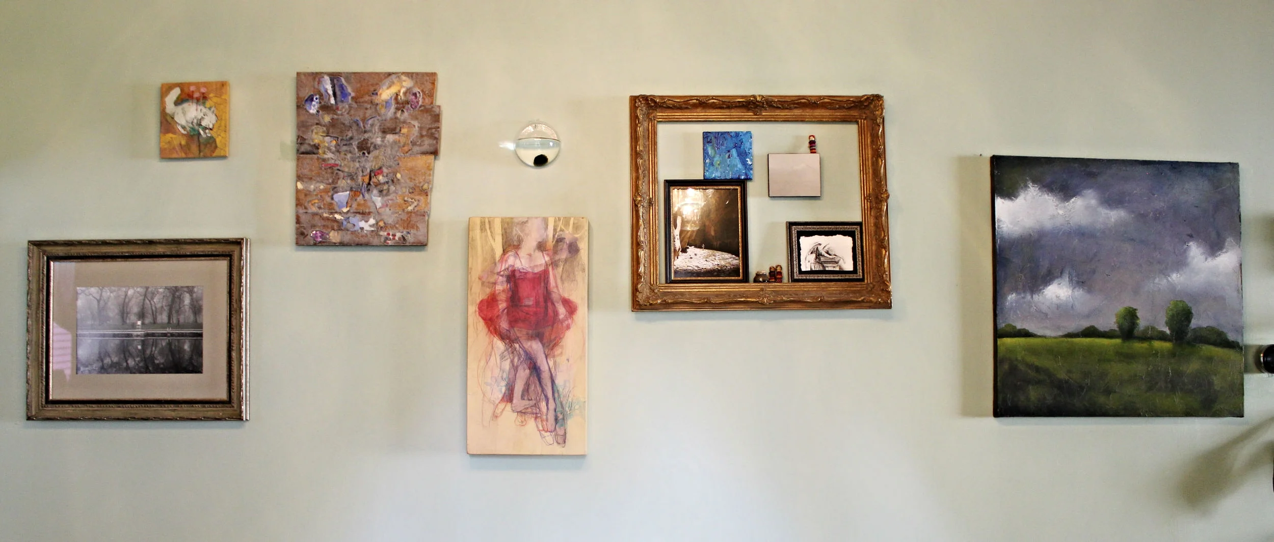 Linear: A scattered linear set up allows viewers to enjoy the artwork at eye level. Off setting each piece is playful and it also takes up space on a large wall. 