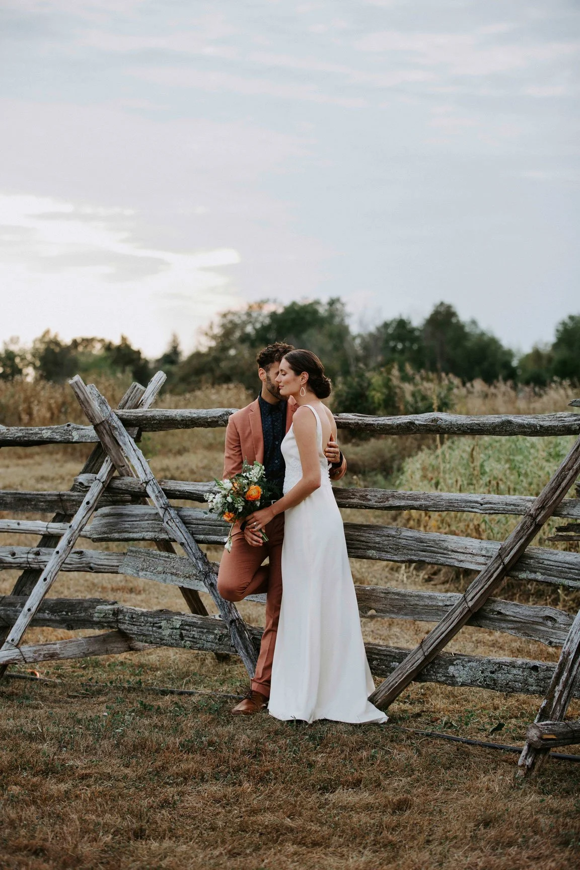 bride and groom at farm wedding, rustic, barns
