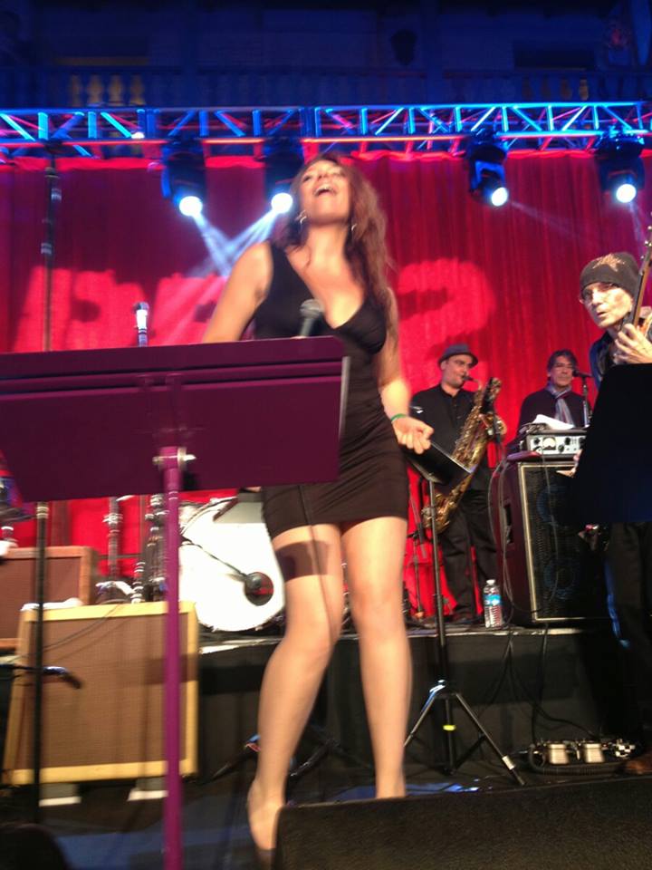 Performing at the Red 2 Premiere
