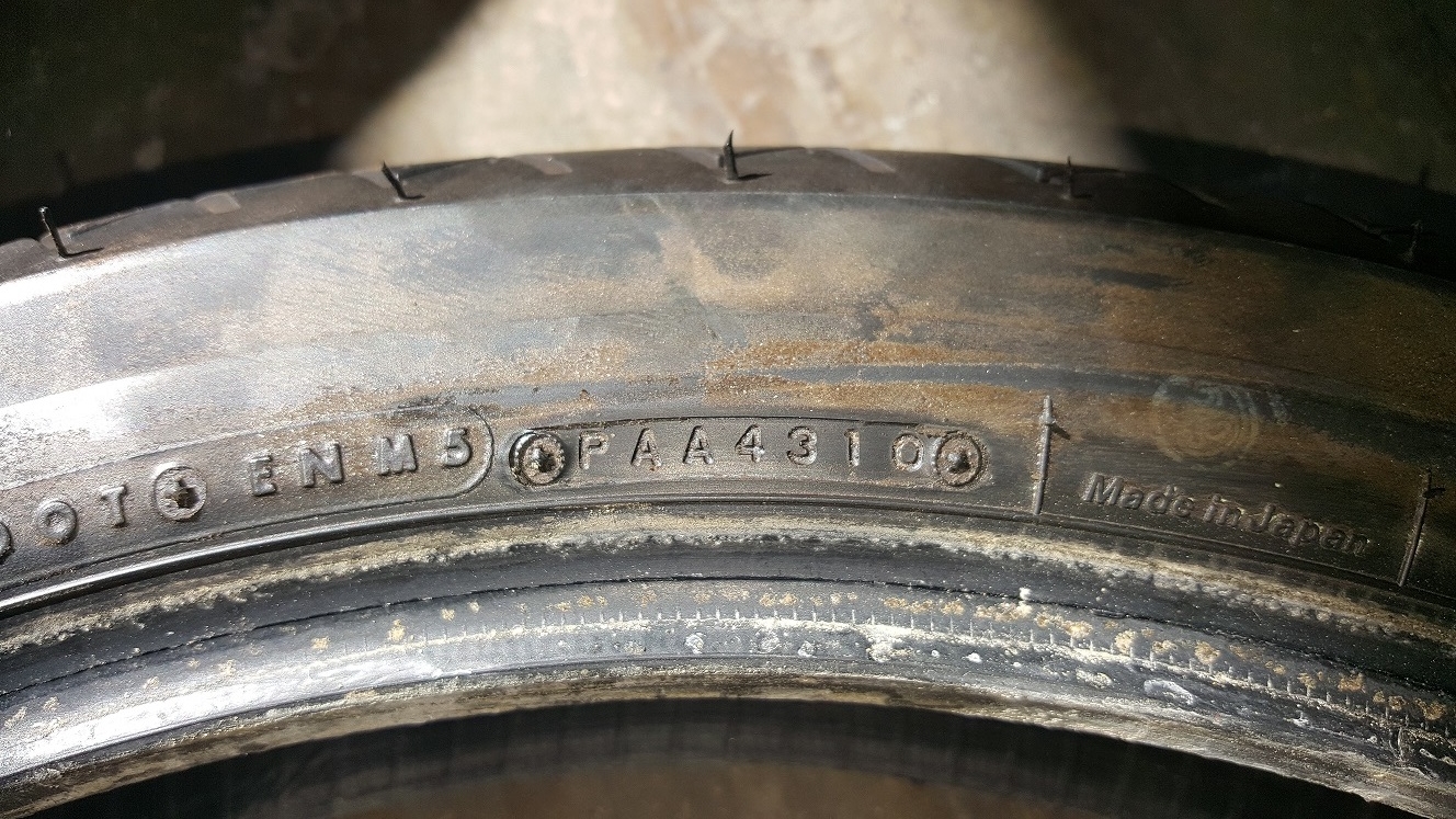 Look for this tire stamp on the sidewall of the tire. Modern tires have a 4 digit code that tells you it was manufactured the 43rd week of 2010.
