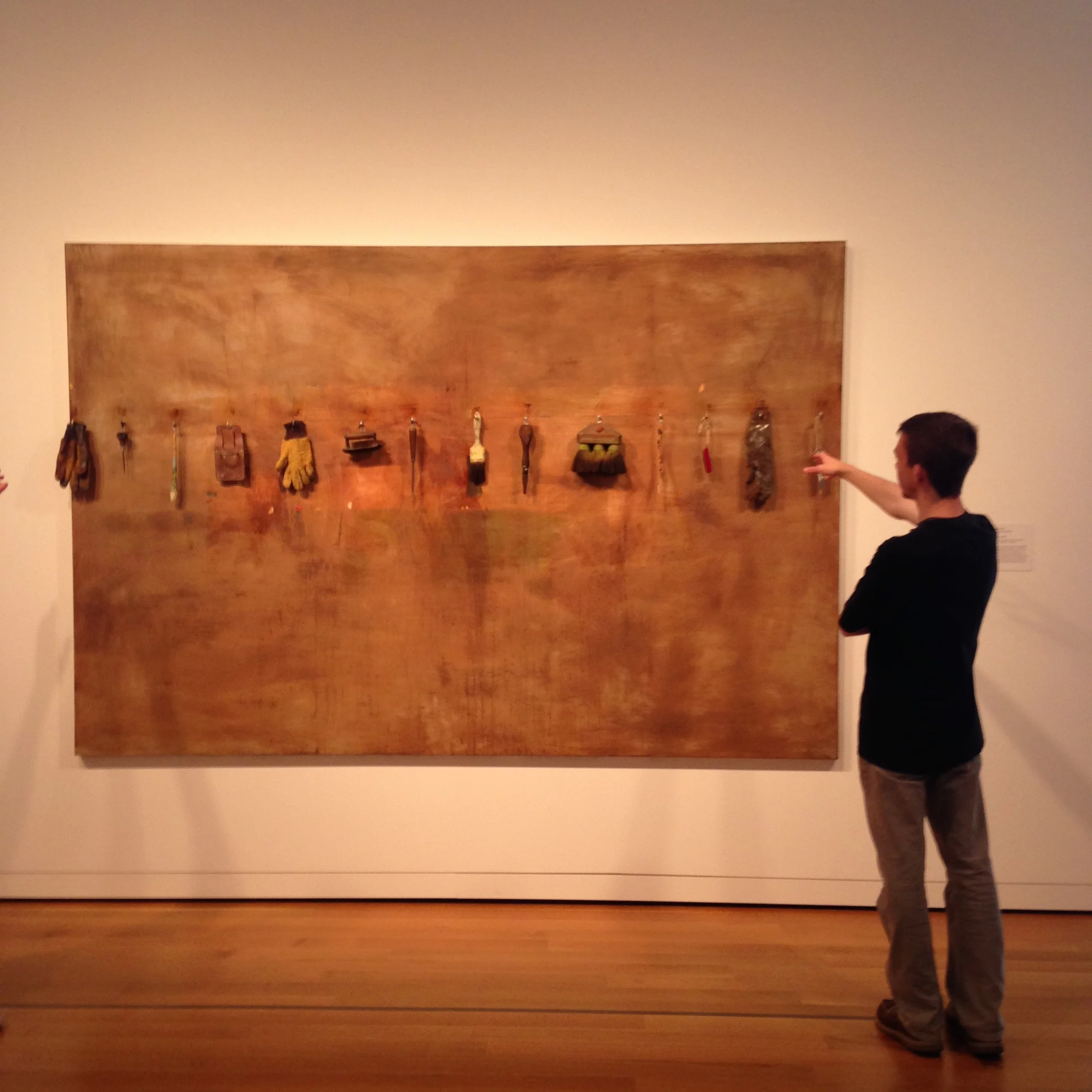 Connor Duggan examines a piece byJim Dine. 