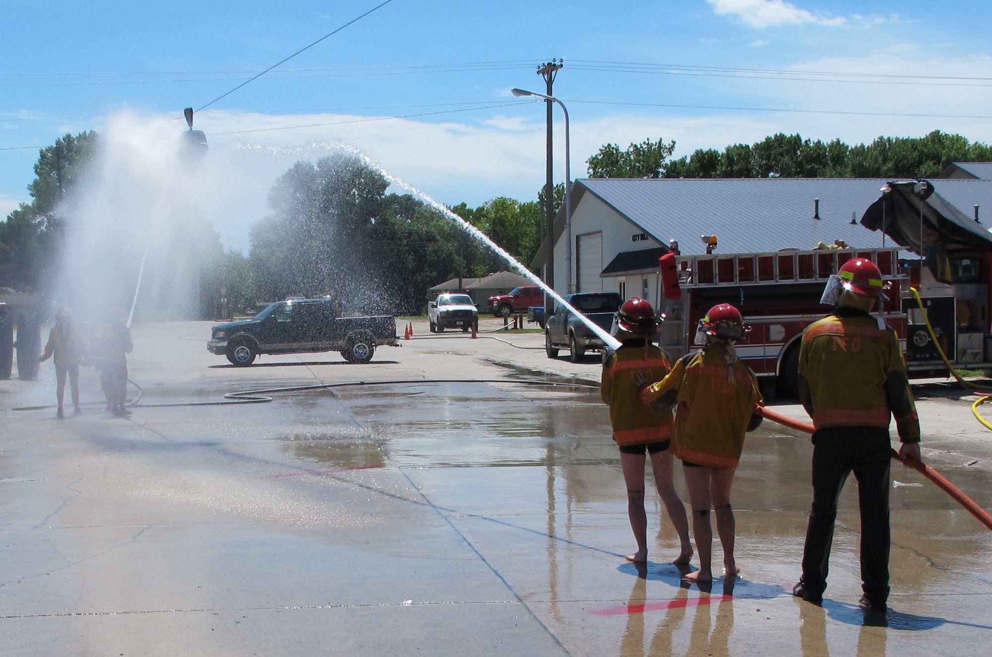 Fire departments set up hose battles for blasting a beer keg down a cable.