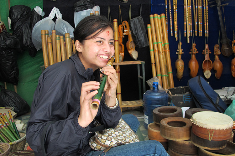 Rupa tries out a flute