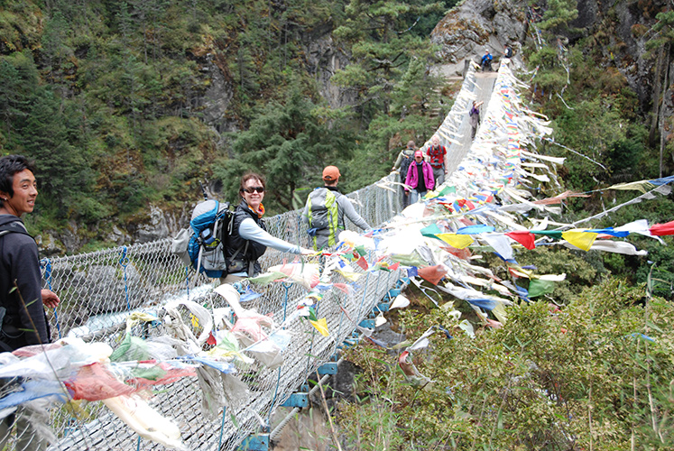 Imja Khola suspension bridge with prayer flags