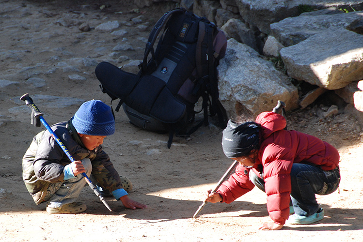 Sherpa boys with trekking pole