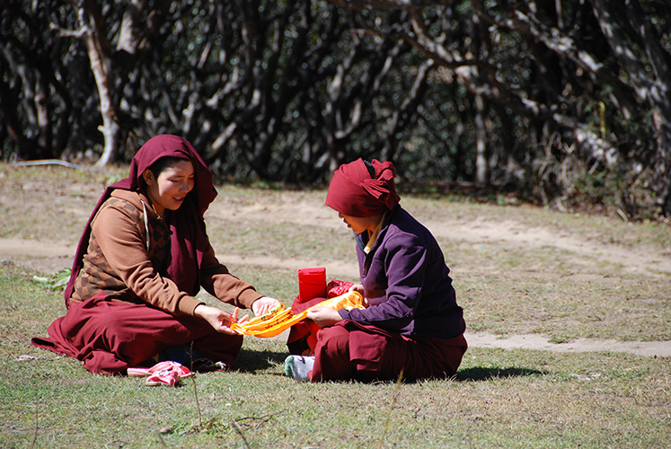Buddhist nuns folding cloth