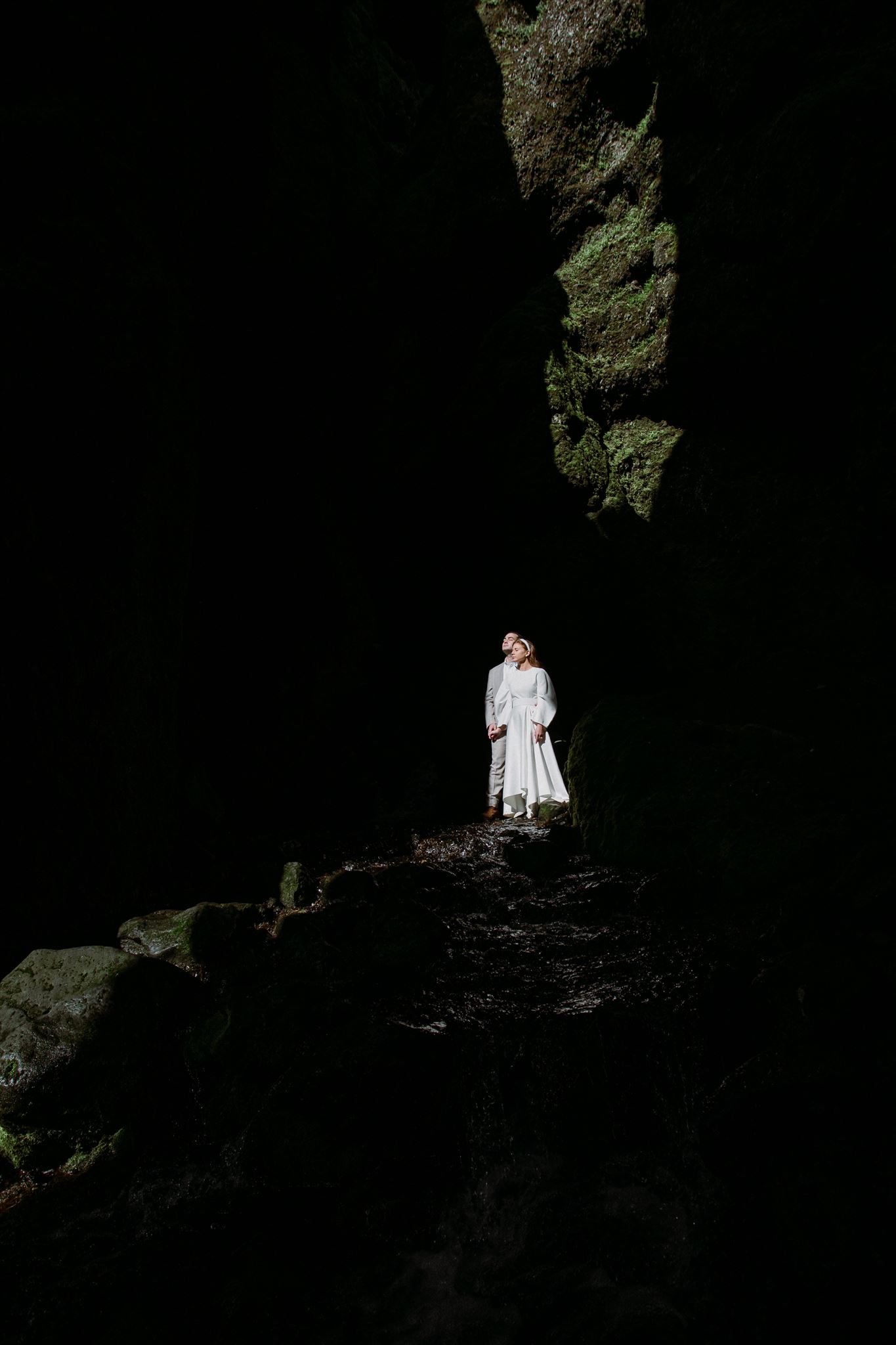 iceland elopement coupe in a cave with cool light