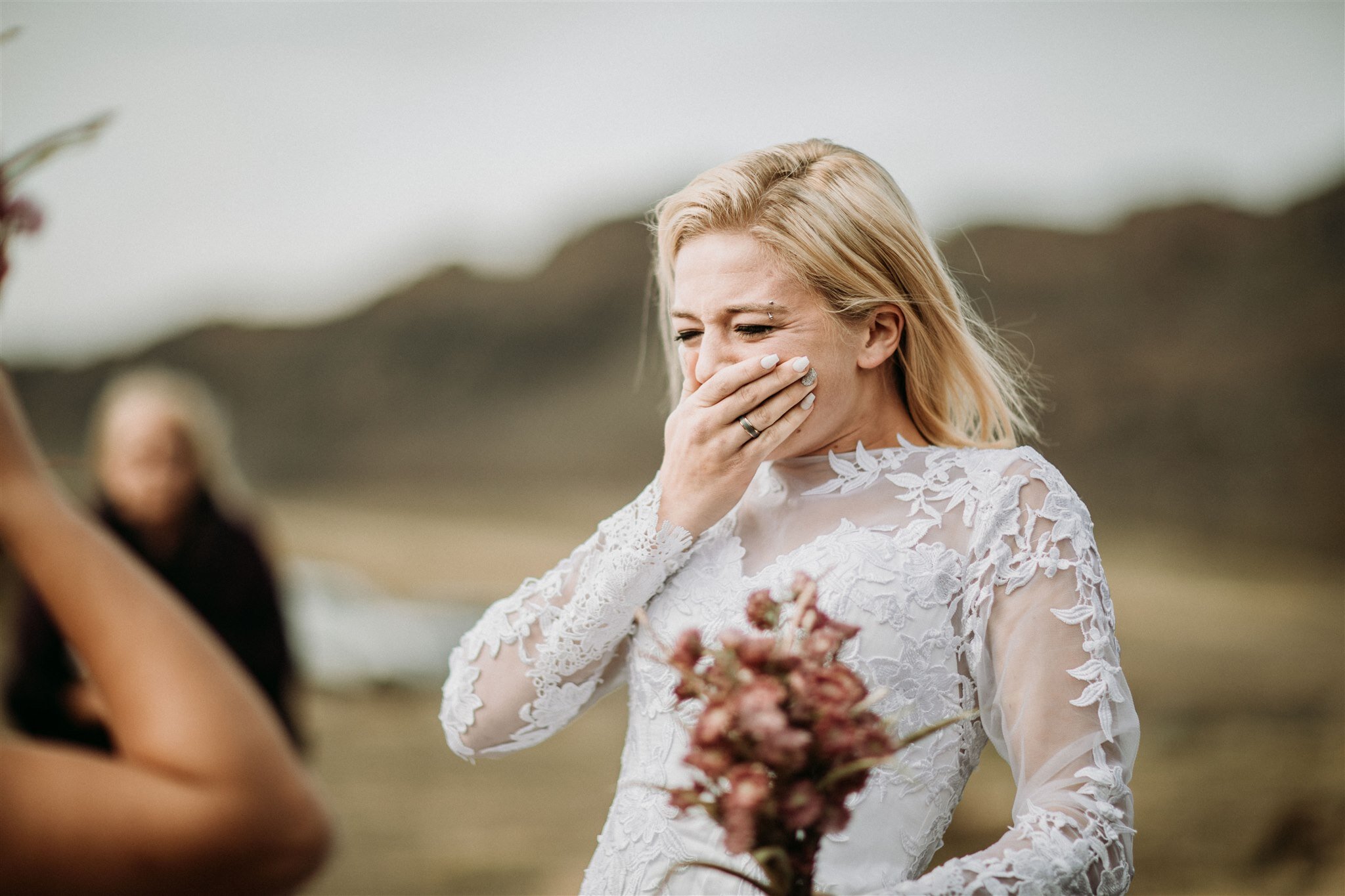 LGBTQ+ elopement photos in iceland | bride reaction shot to her bride | zakas photography 
