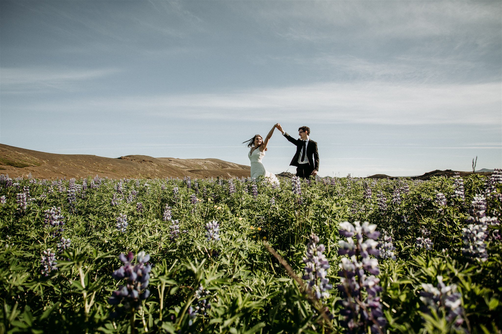 Iceland elopement in lupine field | adventure elopement photographer | zakas photo