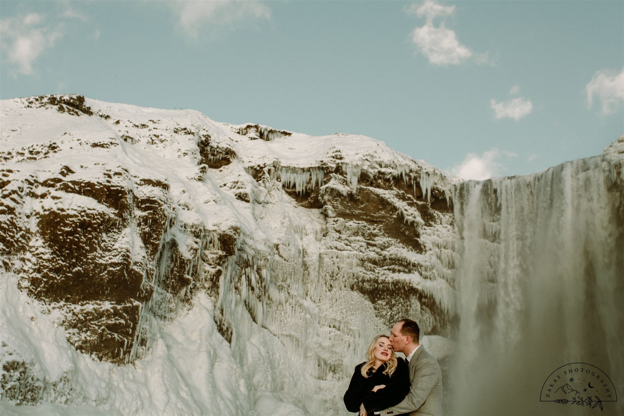 rock n roll elopement in iceland | winter elopement photos at skogafoss | zakas photo