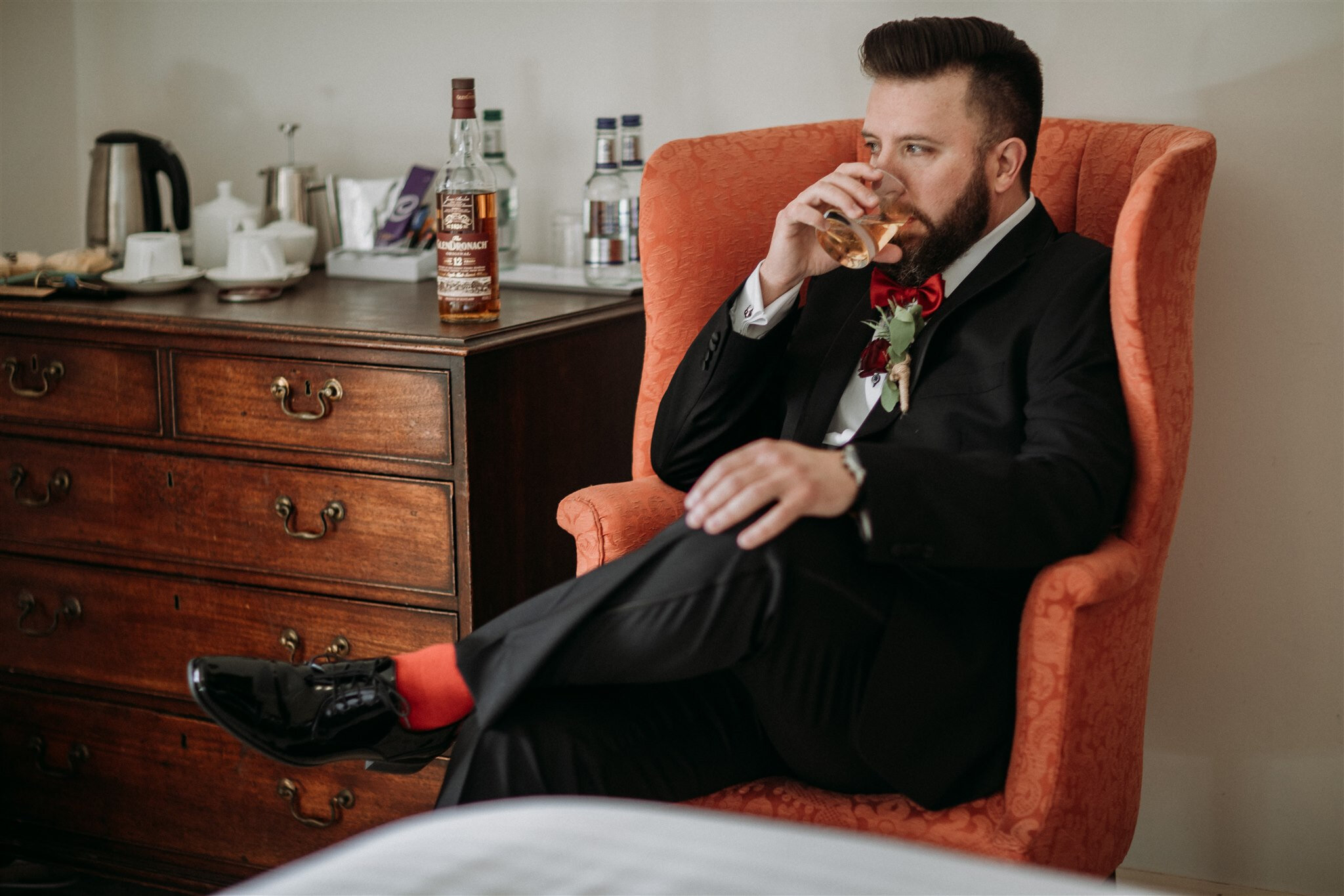 Culzean Castle Scotland elopement groom sitting with a drink | adventure elopement photographer