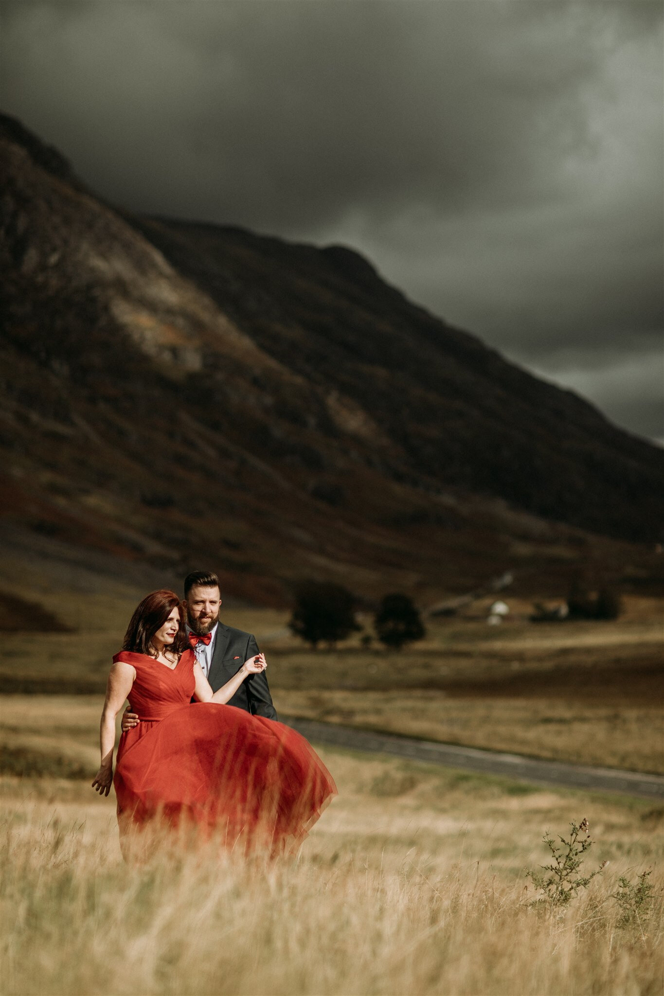 Glen Coe Scotland elopement. Bride in red dress with her groom in the Scottish Highlands | Adventure elopement photographer