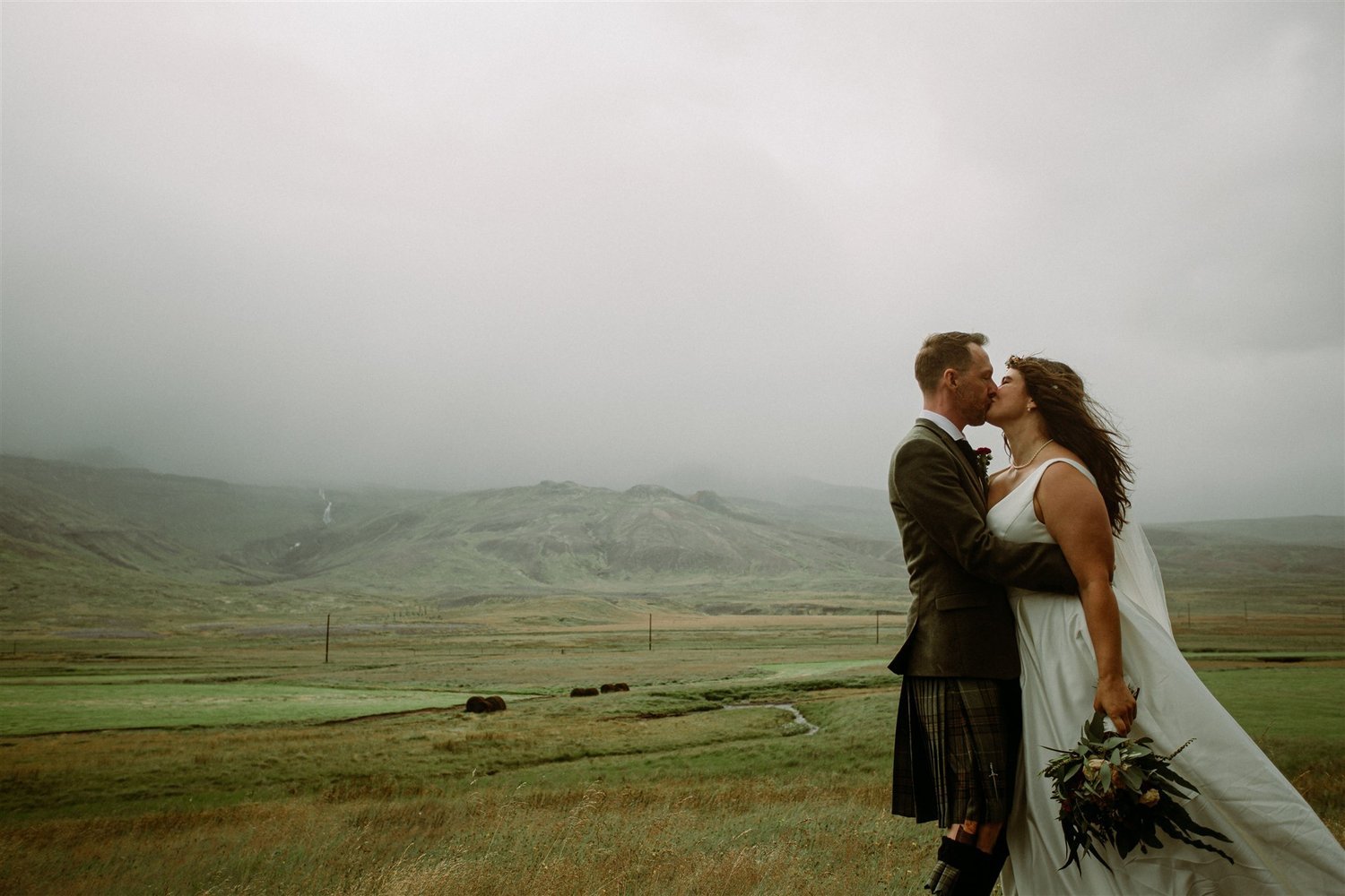 Cloudy weather wont put a dampner of an elopement in Iceland.jpg