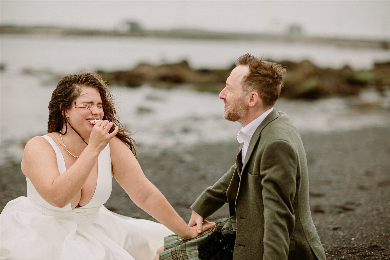 Laughter on the beach during elopement session.jpg