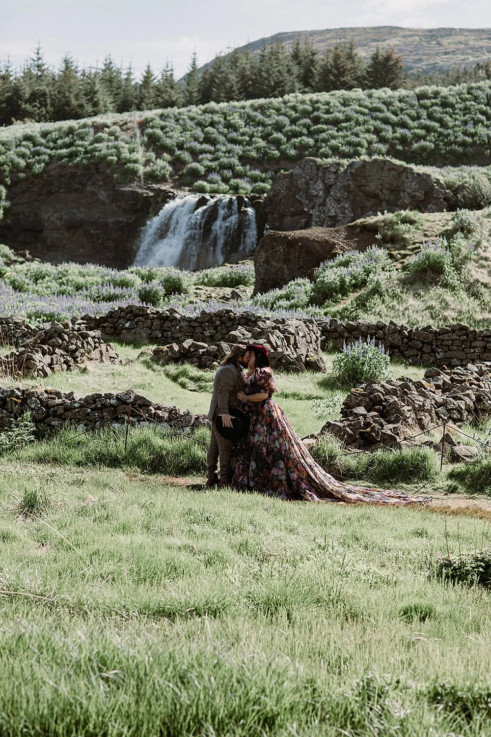 private Iceland elopement in black wedding dress couple waling on trail