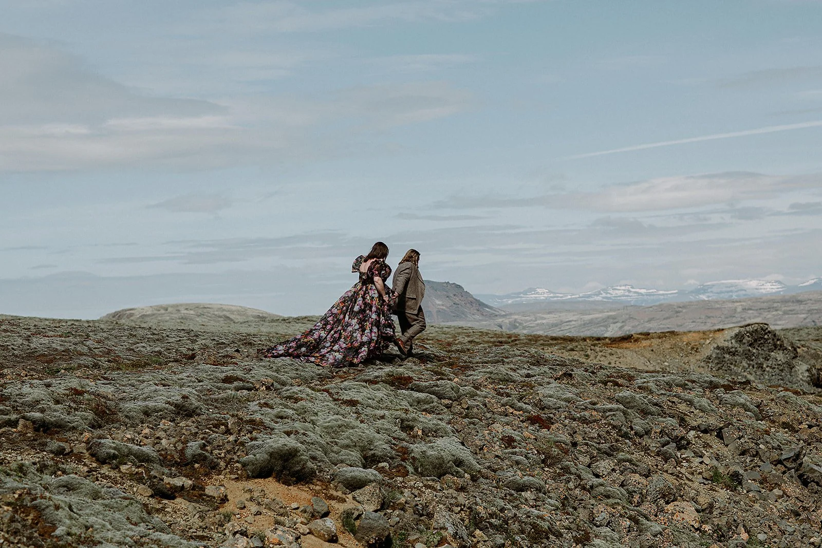 private Iceland elopement in black wedding dress walking