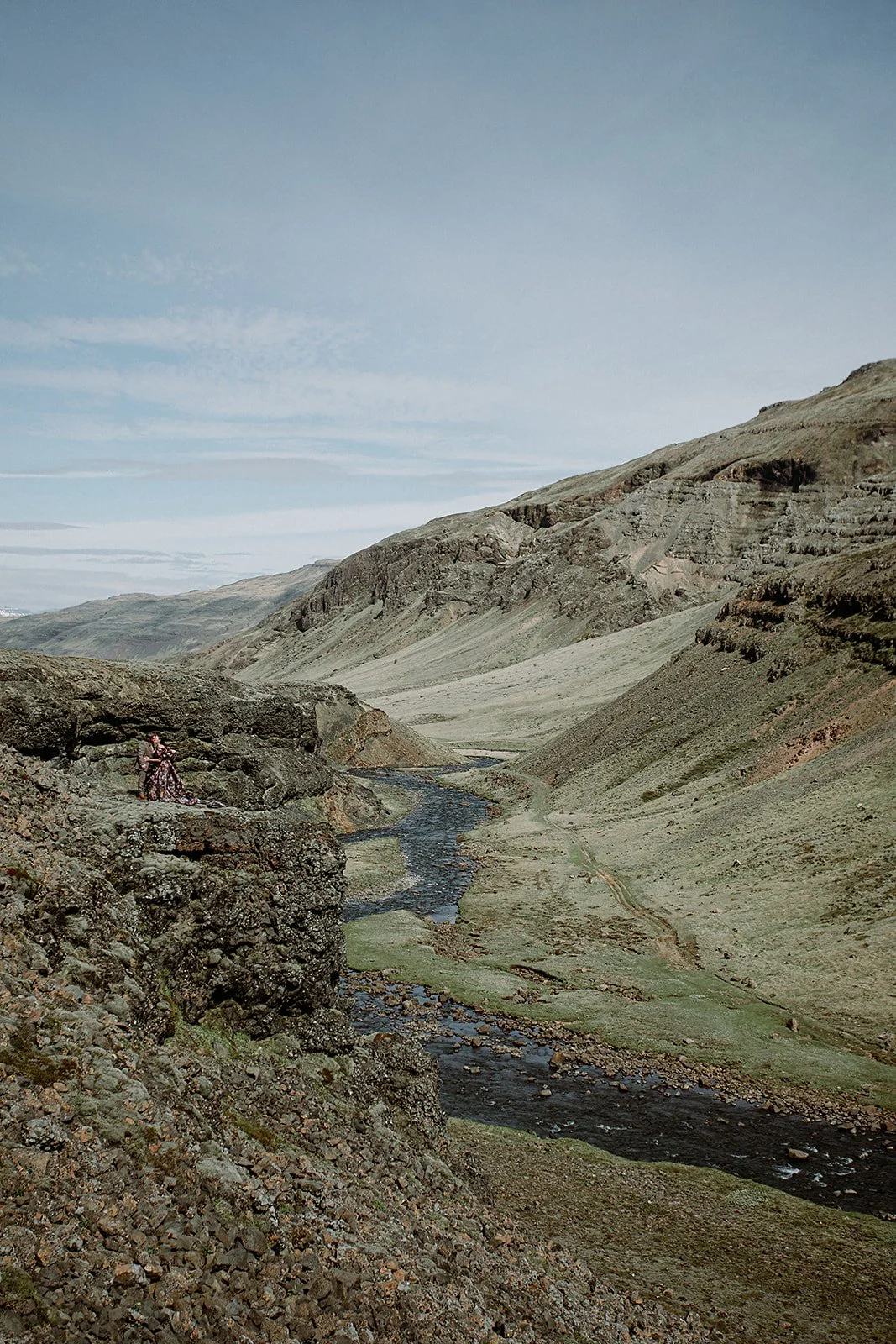 private Iceland elopement in black wedding dress walking