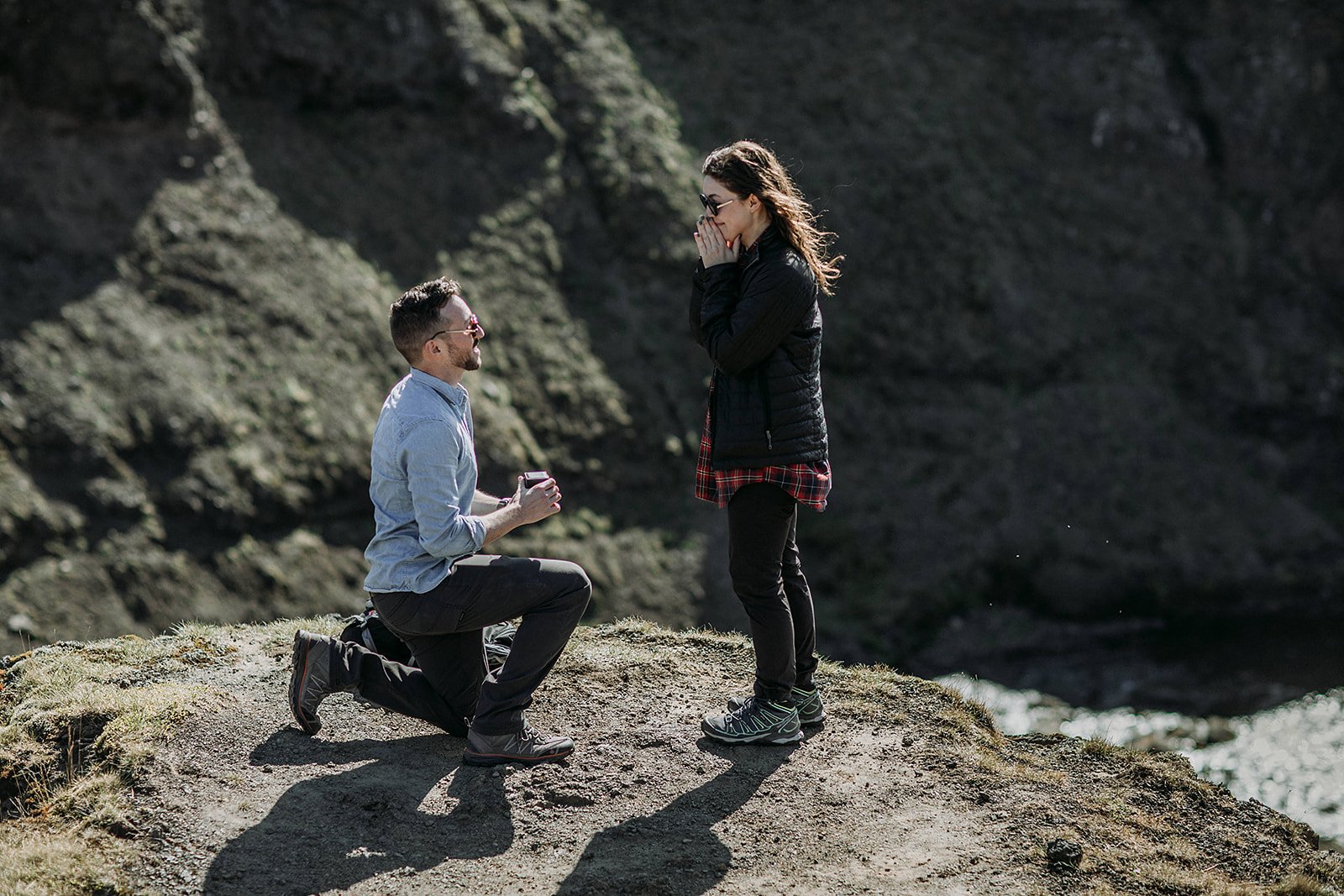 Iceland proposal in the spring time on a tall glacier valley cliff