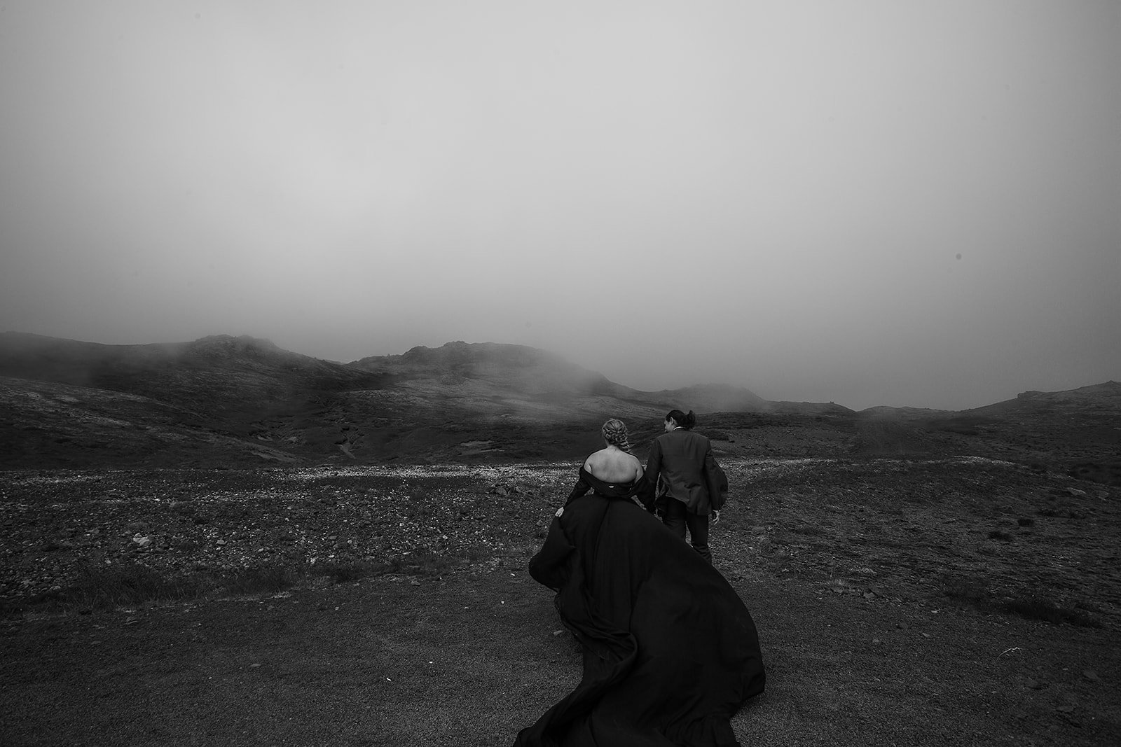 Alternative Iceland elopement couple wearing black wedding dress and purple hair — couple portraits