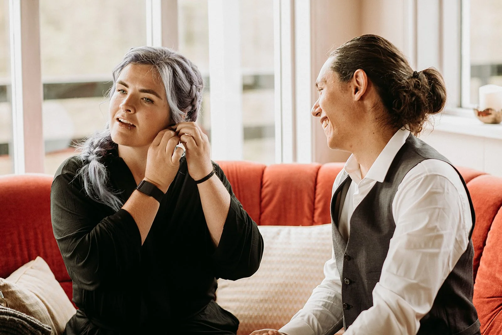 Alternative Iceland elopement couple wearing black wedding dress and purple hair — getting ready for the elopement 