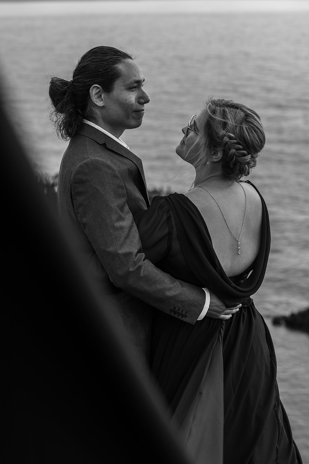 Alternative Iceland elopement couple wearing black wedding dress and purple hair — couples adventure photos