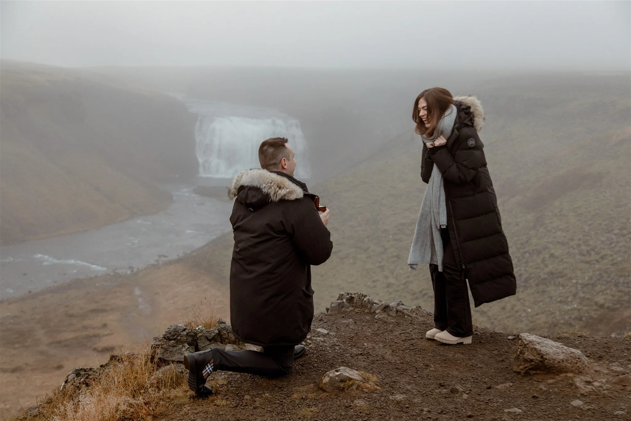  Secret Iceland Proposal at a Foggy Winter Waterfall by a local Iceland Engagement &amp; Proposal Photographer and planner — the proposal moment excitement  