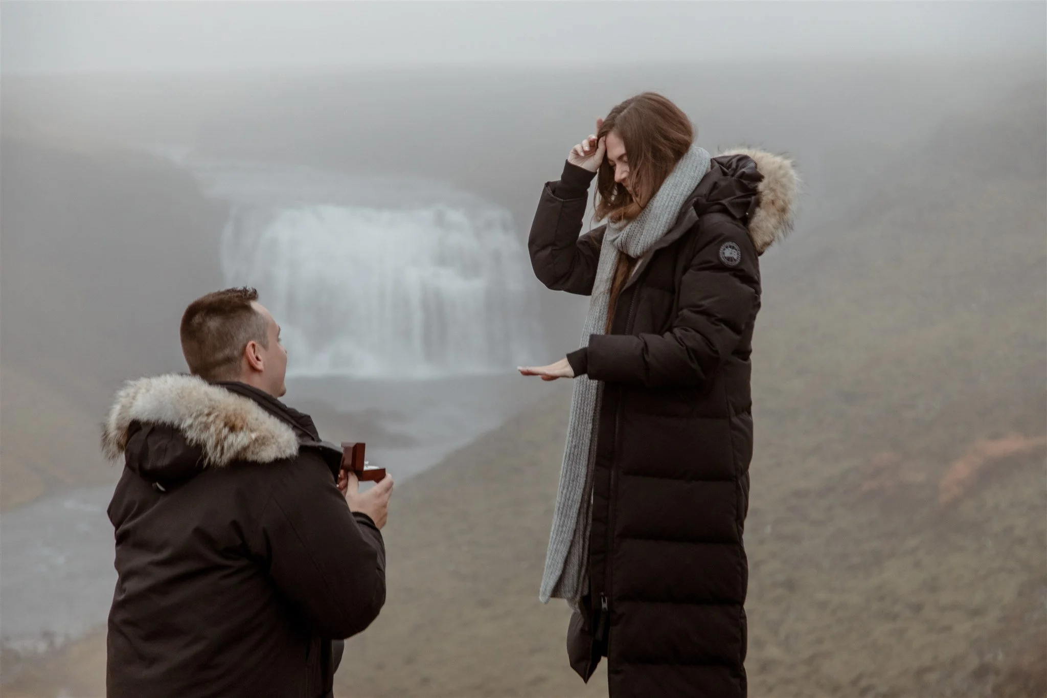  Secret Iceland Proposal at a Foggy Winter Waterfall by a local Iceland Engagement &amp; Proposal Photographer and planner —she said yes 